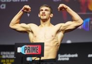 Who is Arnold Allen's coach?